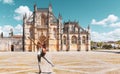 Woman tourist in front of monastery Batalha