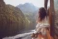 Woman tourist going on boat in Konigssee lake, Berchtesgaden, Ge