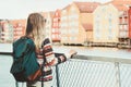 Woman tourist with green backpack sightseeing Trondheim city in Norway vacations weekend Travel Lifestyle fashion outdoor scandina