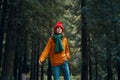 Woman tourist green scarf hat walk forest