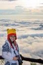 Woman tourist holding a DSLR camera on beautiful nature landscape of fog is like the sea in the winter during sunrise background Royalty Free Stock Photo