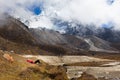 Woman tourist lying resting Ama Dablam base camp.