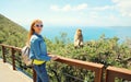 Woman tourist and macaque monkey. Gibraltar, United Kingdom