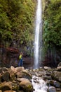 Woman tourist and main waterfall at levada 25 fountains in Rabacal, Madeira island