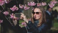 Woman tourist making selfie with Sakura flowers Royalty Free Stock Photo