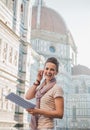 Woman tourist with map having audio walking tour, Florence Royalty Free Stock Photo
