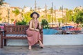 Woman tourist in Old town Kaleici in Antalya. Turkiye. Panoramic view of Antalya Old Town port, Taurus mountains and Royalty Free Stock Photo