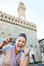 Woman tourist with photo camera showing thumbs up, Florence Royalty Free Stock Photo