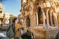 Woman tourist photographing Castillo de Colomares