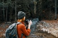 woman tourist photographing nature river forest mountains Royalty Free Stock Photo