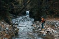 woman tourist photographing nature river forest mountains Royalty Free Stock Photo