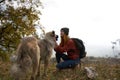 woman tourist playing dog nature landscape friendship
