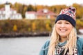 Woman tourist poses for a photo near the Rasperry Island Lighthouse while on a boat cruise of the Apostle Islands in Wisconsin USA Royalty Free Stock Photo