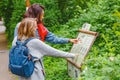 Woman tourist reading information board sign with short info about animal species in the Berlin Zoo Royalty Free Stock Photo