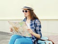 Woman tourist sightseeing city with paper map Royalty Free Stock Photo