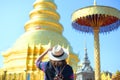 Woman tourist is sightseeing at Wat Phra That Hariphunchai in Lamphun