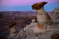 Woman tourist sitting on rock watching sunset.