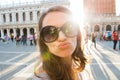 Woman tourist on St. Marks Square taking selfie blowing a kiss