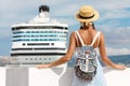 Woman tourist standing in front of big cruise liner, travel female Royalty Free Stock Photo