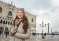 Woman tourist standing on St. Marks Square near Dogi Palace Royalty Free Stock Photo