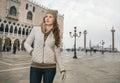 Woman tourist standing on St. Marks Square near Dogi Palace Royalty Free Stock Photo