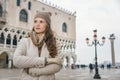 Woman tourist standing on St. Marks Square near Dogi Palace Royalty Free Stock Photo