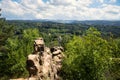 Woman tourist stands on rock top in resort park, Kislovodsk, Russia