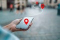 Woman tourist use maps app to navigate city, plan route from location to destination Royalty Free Stock Photo