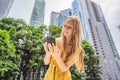 Woman Tourist using navigation app on the mobile phone. Navigation map on a smartphone in a big city Royalty Free Stock Photo