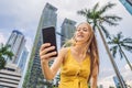 Woman Tourist using navigation app on the mobile phone. Navigation map on a smartphone in a big city Royalty Free Stock Photo