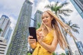 Woman Tourist using navigation app on the mobile phone. Navigation map on a smartphone in a big city Royalty Free Stock Photo