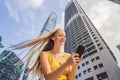 Woman Tourist using navigation app on the mobile phone. Navigation map on a smartphone in a big city Royalty Free Stock Photo