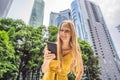 Woman Tourist using navigation app on the mobile phone. Navigation map on a smartphone in a big city Royalty Free Stock Photo