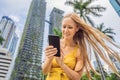 Woman Tourist using navigation app on the mobile phone. Navigation map on a smartphone in a big city Royalty Free Stock Photo