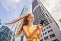 Woman Tourist using navigation app on the mobile phone. Navigation map on a smartphone in a big city Royalty Free Stock Photo