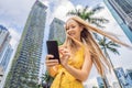 Woman Tourist using navigation app on the mobile phone. Navigation map on a smartphone in a big city Royalty Free Stock Photo