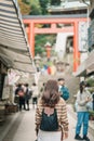 Woman tourist Visiting in Enoshima Island, Fujisawa, Kanagawa, Japan. happy Traveler sightseeing Enoshima Shrine. Landmark and Royalty Free Stock Photo