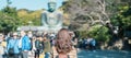 Woman tourist Visiting in Kamakura, Kanagawa, Japan. happy Traveler sightseeing the Great Buddha statue. Landmark and popular for