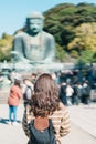 Woman tourist Visiting in Kamakura, Kanagawa, Japan. happy Traveler sightseeing the Great Buddha statue. Landmark and popular for