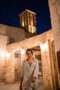 Woman tourist walking in Al Seef Meraas Dubai - old historical district with traditional Arabic architecture Royalty Free Stock Photo