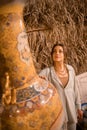 Woman tourist walking in Arab market near Al Seef with crockery, lamps and lanterns in the old style