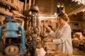 Woman tourist walking in Arab market near Al Seef with crockery, lamps and lanterns in the old style