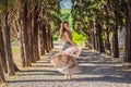 Woman tourist walking in Montenegro. Panoramic summer landscape of the beautiful green Royal park Milocer on the shore Royalty Free Stock Photo