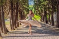 Woman tourist walking in Montenegro. Panoramic summer landscape of the beautiful green Royal park Milocer on the shore Royalty Free Stock Photo