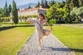 Woman tourist walking in Montenegro. Panoramic summer landscape of the beautiful green Royal park Milocer on the shore Royalty Free Stock Photo