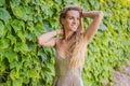 Woman tourist walking in Montenegro. Panoramic summer landscape of the beautiful green Royal park Milocer on the shore Royalty Free Stock Photo