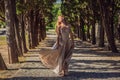 Woman tourist walking in Montenegro. Panoramic summer landscape of the beautiful green Royal park Milocer on the shore Royalty Free Stock Photo