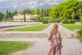Woman tourist walking together in Montenegro. Panoramic summer landscape of the beautiful green Royal park Milocer on Royalty Free Stock Photo