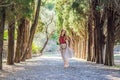 Woman tourist walking together in Montenegro. Panoramic summer landscape of the beautiful green Royal park Milocer on Royalty Free Stock Photo