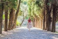 Woman tourist walking together in Montenegro. Panoramic summer landscape of the beautiful green Royal park Milocer on Royalty Free Stock Photo